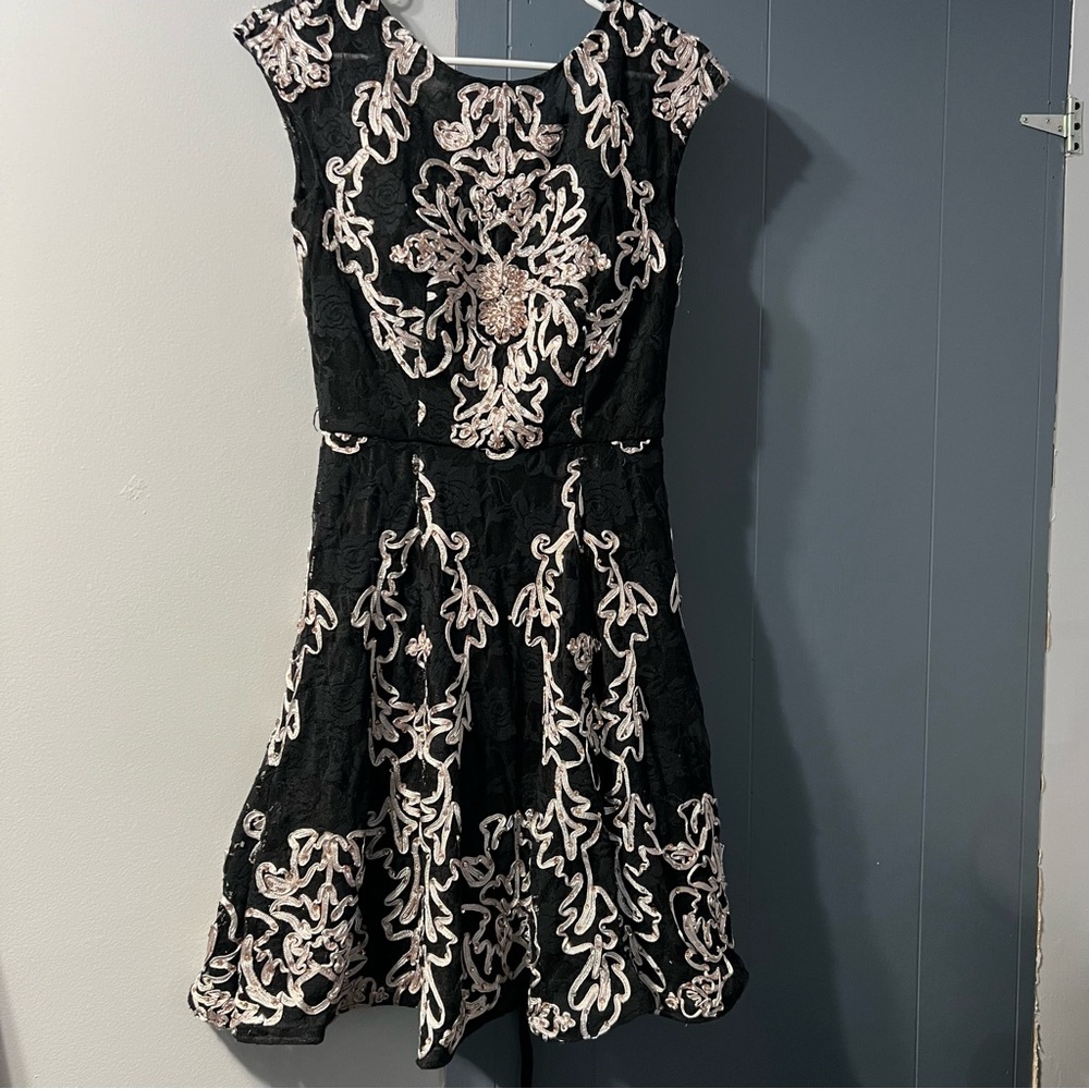 Jovani short black dress with light pink design and rhinestones. Size 4